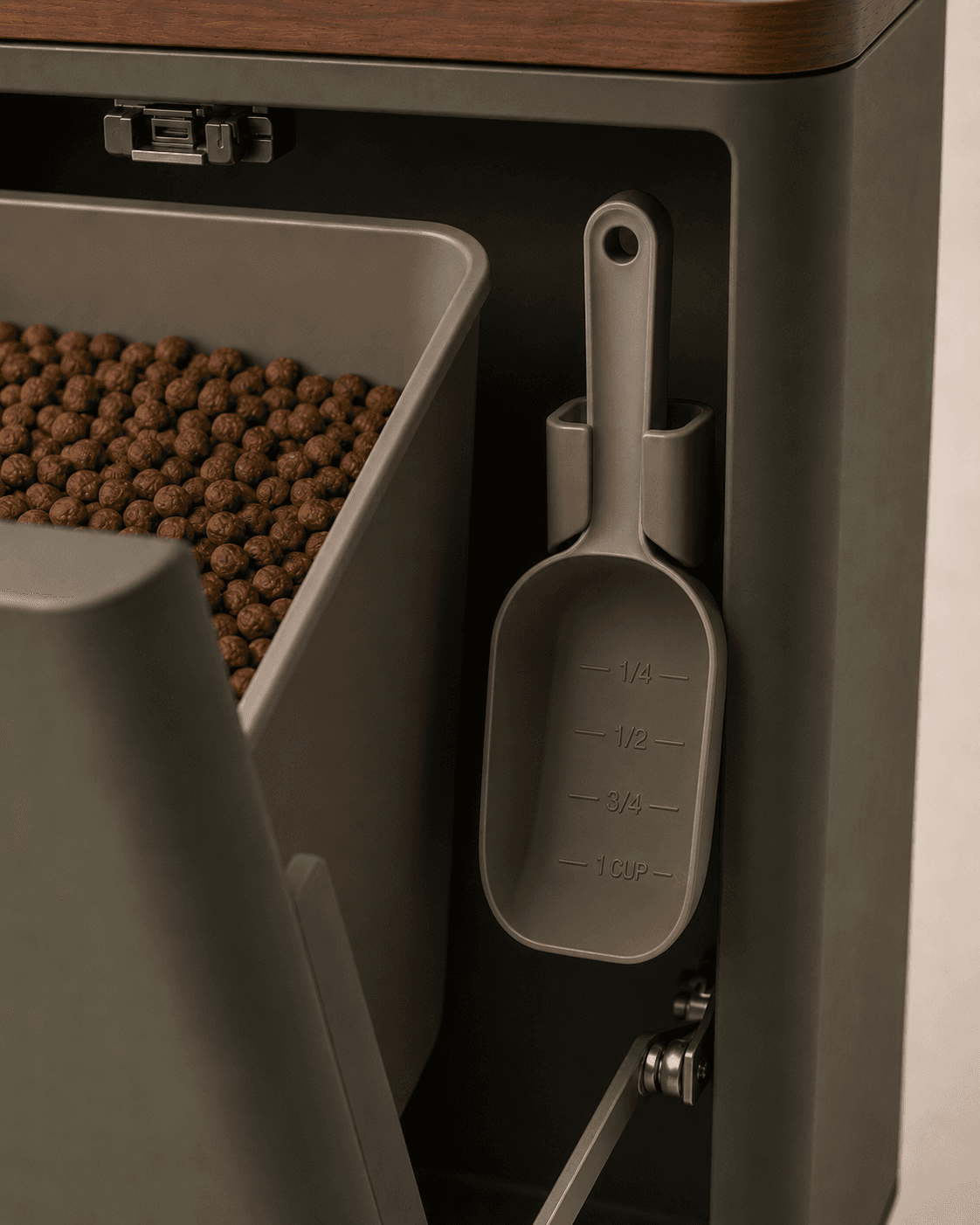 Close-up of Denwell hidden scoop holster storing a one-cup scoop inside the cabinet